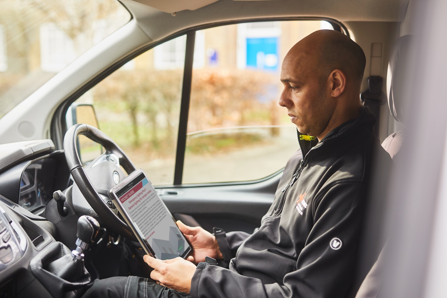 NICEIC engineer using a tablet